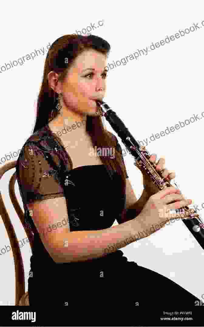 A Clarinetist Performing A Classical Piece, Their Fingers Dancing Over The Keys As They Fill The Air With Enchanting Melodies. Beautiful Classical Songs For CLARINET And Piano Accompaniment: 12 Popular Wedding Pieces * Easy And Intermediate Level Arrangements * Sheet Music For Kids Students Adults * Complete