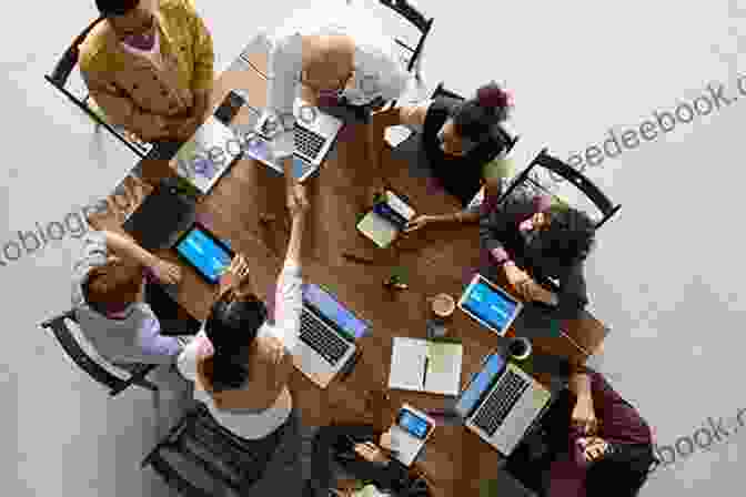 A Group Of People Brainstorming Around A Table, Symbolizing Purposeful Branding Creating Powerful Brands Dr Mia Clarke