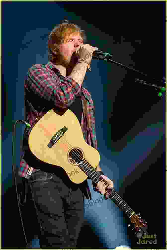 Ed Sheeran Performing In Front Of A Large Crowd Ed Sheeran: A Visual Journey