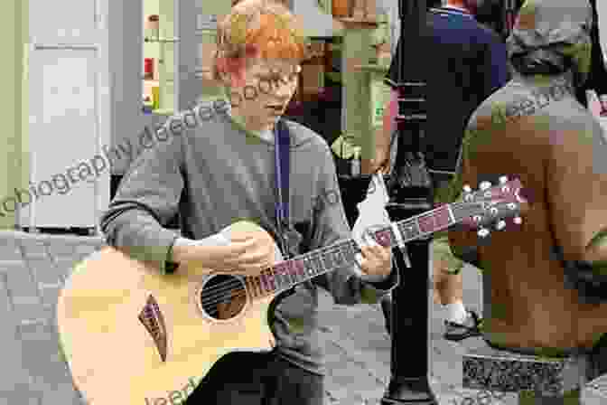 Ed Sheeran Playing Guitar On The Streets Of London Ed Sheeran: A Visual Journey